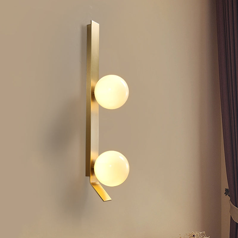 Applique murale double globe linéaire Clémence en laiton