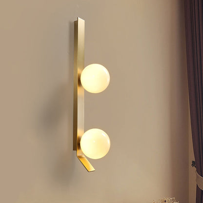 Applique murale double globe linéaire Clémence en laiton