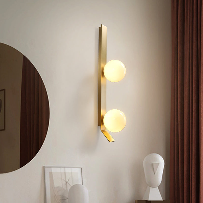 Applique murale double globe linéaire Clémence en laiton