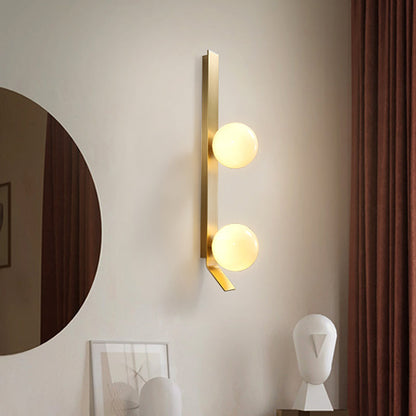 Applique murale double globe linéaire Clémence en laiton
