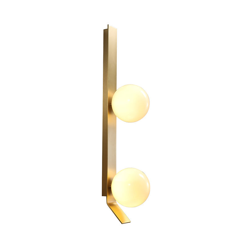 Applique murale double globe linéaire Clémence en laiton