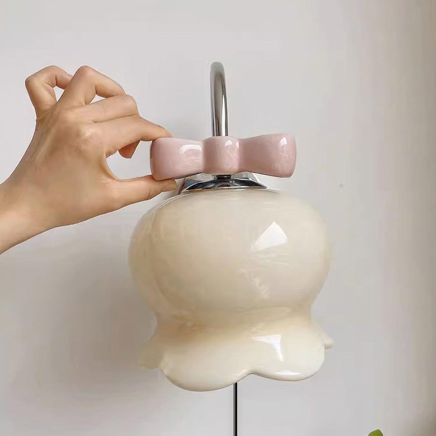 Applique murale à brancher Chloé Bell avec nœud décoratif